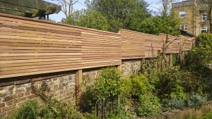 A fence in sloping garden that steps up gradually