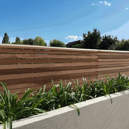 Cedar battens used to create a contemporary style fence. the Cedar has lovely colours.