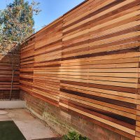 Red Canadian Cedar Slatted Fence Panel. Can be created with the 1m, 1.5m, 1.83m and 2.13m size battens we have available.