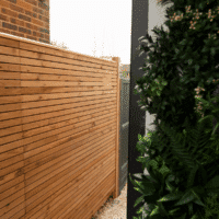 Venetian panels used as an alleyway fence.