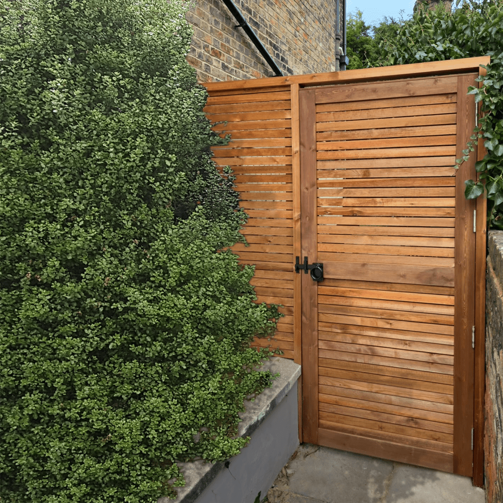 A Venetian Redwood gate with a matching Venetian Redwood fence.