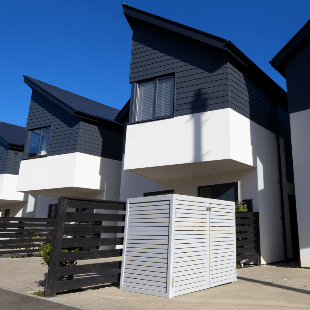 Grey wheelie bin store on a driveway of a contemporary home