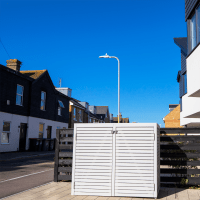 Light grey Wheelie bin store with a blue sky