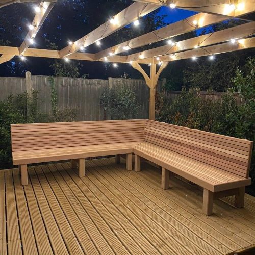 Cedar Bench with Cedar legs in a pergola at night