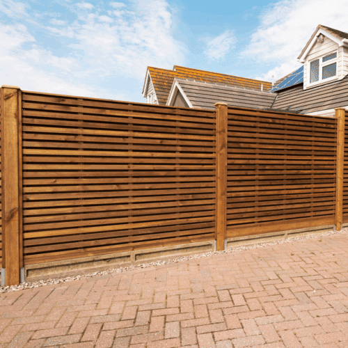 Double slatted fencing panel made in a hit and miss configuration. In simple, each side's gaps are covered by the opposite sides slats.