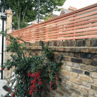 Cedar fence on top of wall