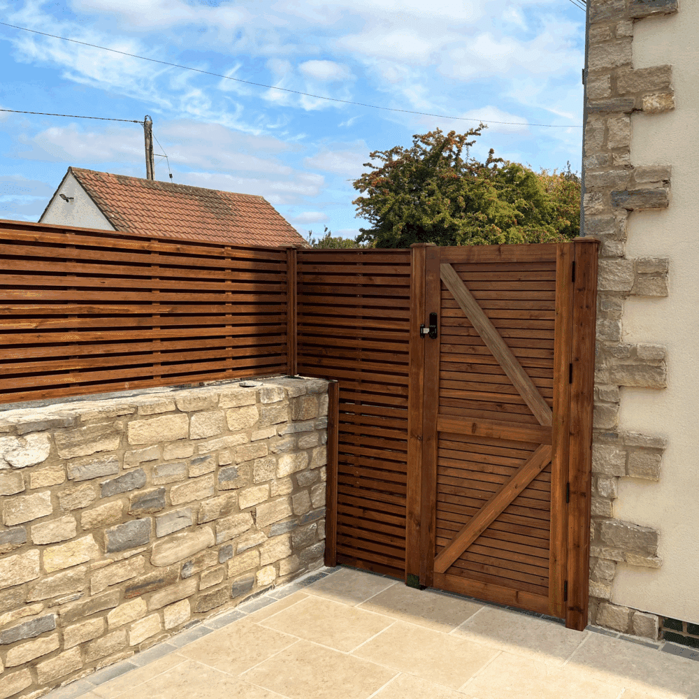The rear of a venetian gate in a slatted hit and miss style.